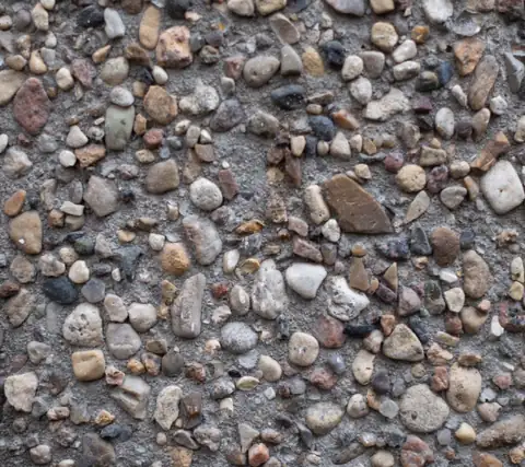 Close-up of heavy river-rock exposed aggregate concrete
